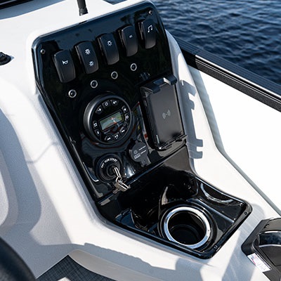 Molded dash panel with radio and toggle switches (wireless phone charger available with the Mood Package)