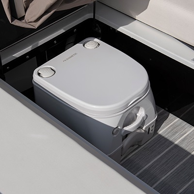 Optional chemical head with holding tank and pump out system