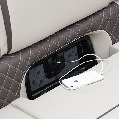 Lounger cup holders with USB ports integrated into furniture