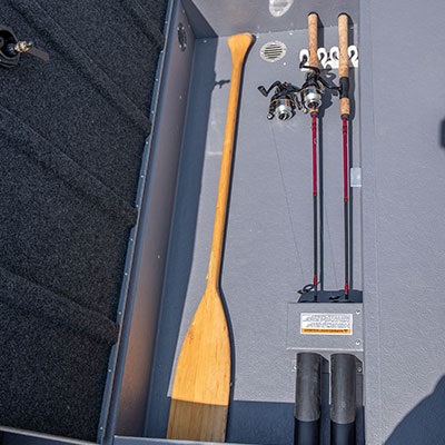 Lockable in-floor storage compartment