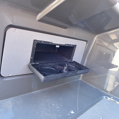 Glove box integrated in the helm