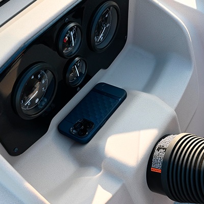 Dashboard featuring four gauges and an open storage area