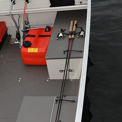 Battery storage compartment including 12V or 24V bow trolling motor plug and receptacles with wiring harness